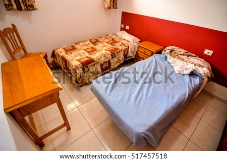 Photo Picture Interior of a cheap hotel bedroom