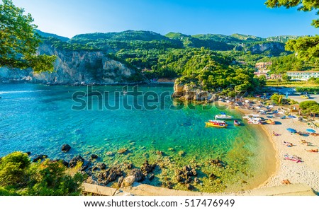 Beautiful beach and boat in Paleokastritsa, Corfu island, Greece Royalty-Free Stock Photo #517476949