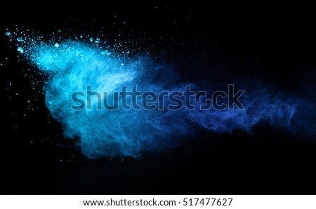 Blue powder explosion on black background. Colored cloud. Colorful dust explode. Paint Holi. Royalty-Free Stock Photo #517477627