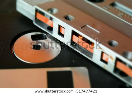 Old technology: tape and floppy disk. Tilt-shift effect applied. Macro.
