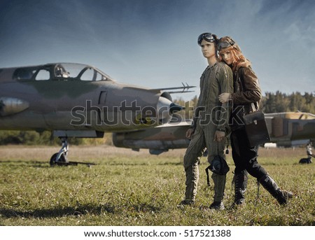 The guy and the girl, pilots preparing to fly on a plane. Style, fashion, beauty, fly, relationships, love.