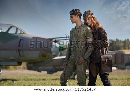 The guy and the girl, pilots preparing to fly on a plane. Style, fashion, beauty, fly, relationships, love.