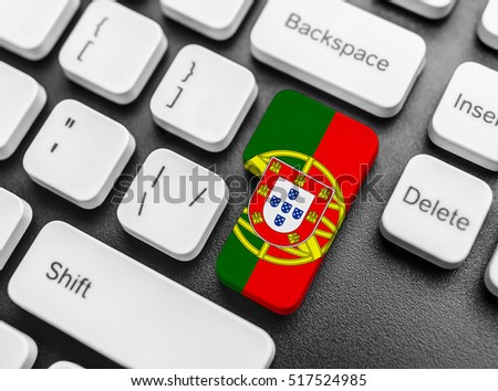 Enter key button with Flag of Portugal. Close-up.