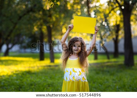 girl holding clean  sheet paper. banner for your message