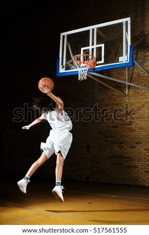 Basketball player aiming at hoop