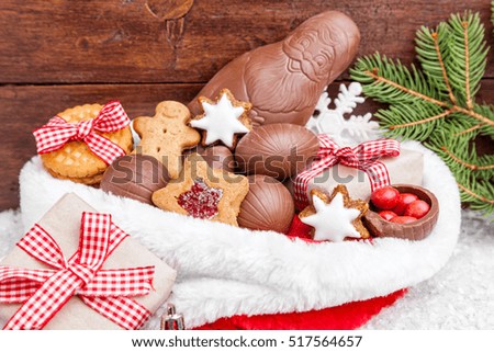 Festive Christmas wooden background with sweets and decoration