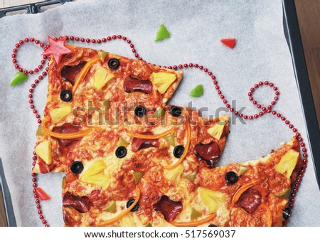Christmas tree pizza for Christmas dinner, top view blank space for text