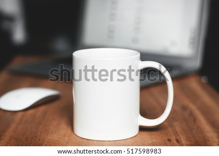 White mug on the desktop Royalty-Free Stock Photo #517598983