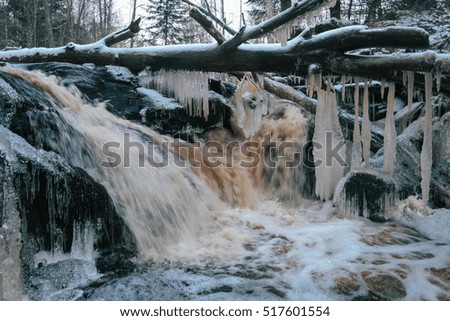 forest waterfall close-up in winter.