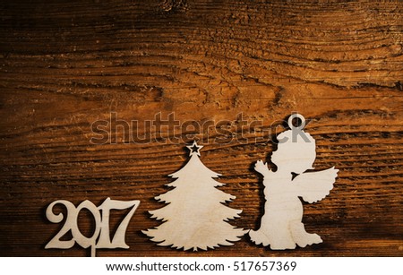wooden angel. star in hands of angel. European holiday traditions. Christmas tree - holiday concept. 2017 happy new year