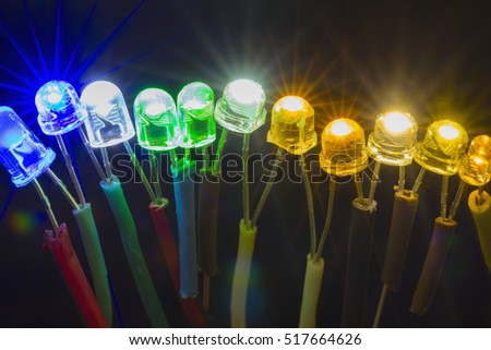 Row of colorful shining led lights connected to each other Royalty-Free Stock Photo #517664626