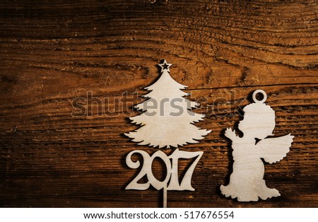 wooden angel. star in hands of angel. European holiday traditions. Christmas tree - holiday concept. 2017 happy new year