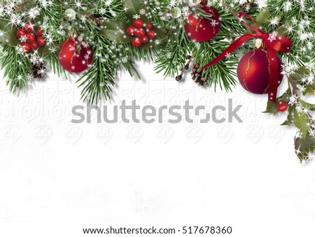 Christmas card with fir branches, balls and holly on a white bac