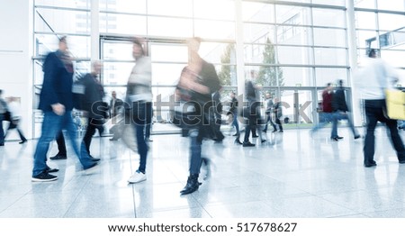 Abstract Image of Business People Walking at a Exhibition
