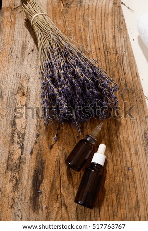 Bunch of lavender flowers with massage ball on old wooden 