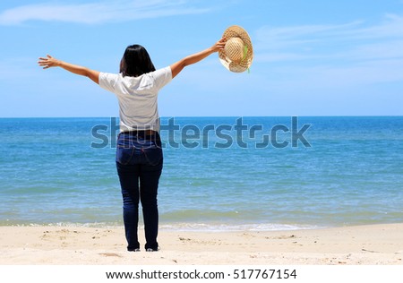 Asian Girl is happy on the beach.concept happy time happy relax