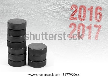 Season 2016-2017 year and hockey puck on ice. Concept, hockey