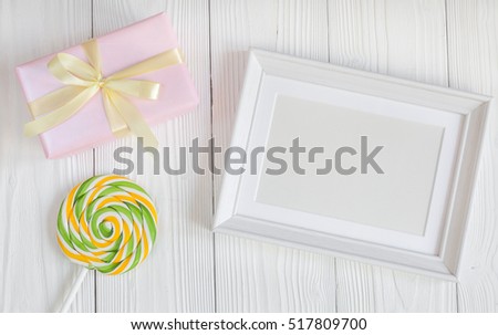 birth of child - blank picture frame on wooden background