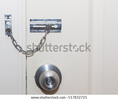 Locked doors. The locking mechanism on the old door Royalty-Free Stock Photo #517832725