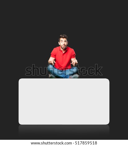 man sitting pointing down