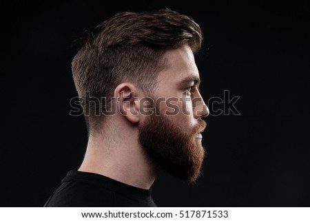 Athletic man in profile. isolated dark background