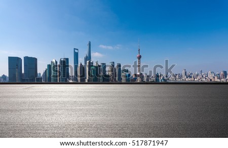 Empty road floor surface with modern city landmark buildings in Shanghai skyline of panorama 