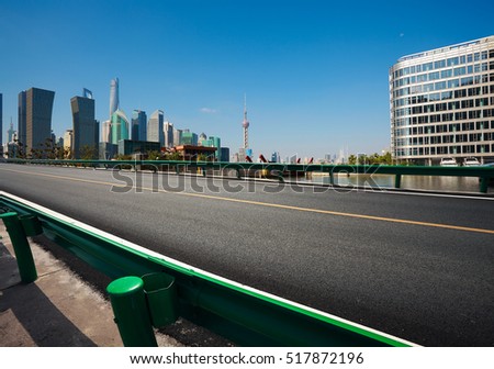Empty road floor surface with modern city landmark buildings in Shanghai