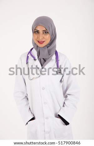 Arab female doctor in white coat holding stethoscope