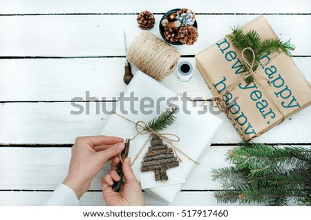 packaging gift white box New year with a decorative Christmas tree on wooden white background