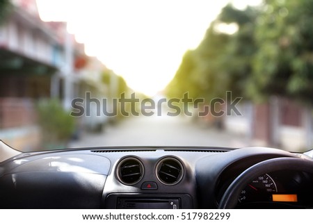 car dashboard in front of village Royalty-Free Stock Photo #517982299