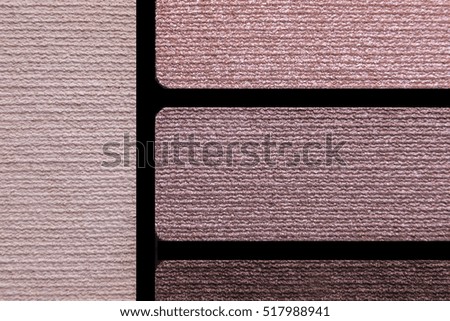 Closeup of makeup accessories color palette reds rose lips skin and eyeshadows