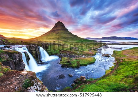 The picturesque sunset over landscapes and waterfalls. Kirkjufell mountain,Iceland  Royalty-Free Stock Photo #517995448
