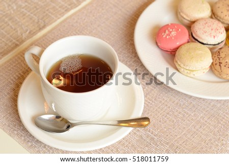 Colorful sweet macaroon with tea