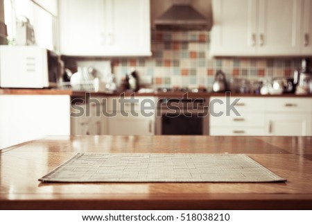 Blurred kitchen interior and napkin and desk space Royalty-Free Stock Photo #518038210