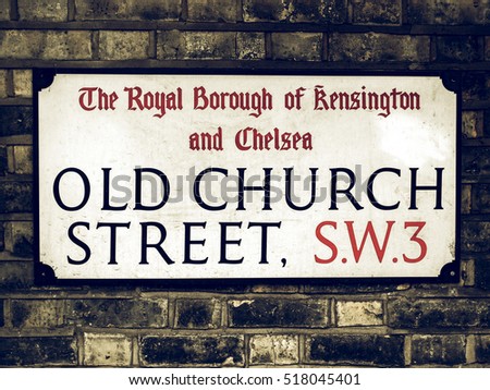 Vintage looking Old street sign in Chelsea, London, UK