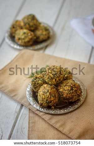 Chickpea falafel balls on metal plate. Falafel is vegetarian dish