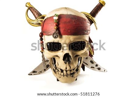 Sculpture of skull with knives, beads and triangular scarf