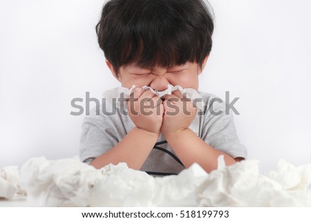 sick little Asian boy wiping or cleaning nose with tissue isolated white background
 Royalty-Free Stock Photo #518199793