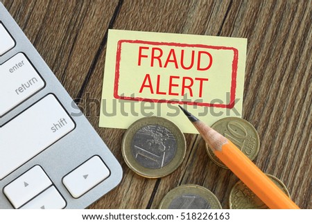 fraud alert concept with money and desk background
