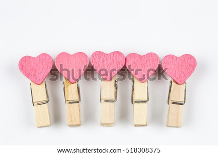 Pink heart wood clips isolate on white