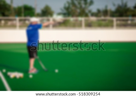 Abstract blur. Abstract blur of Hockey players on the turf. While practicing