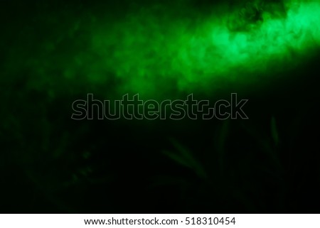 Illuminated stage with scenic lights and smoke. 