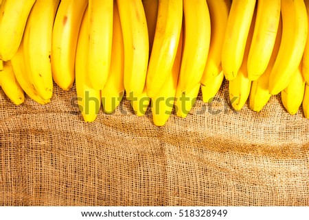 lot of bananas on burlap Royalty-Free Stock Photo #518328949