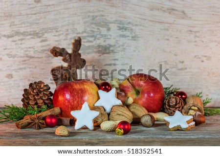 Funny Christmas card with reindeer, cookies, apples, nuts, cinnamon and anise rustic decoration