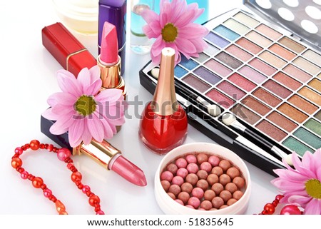Many woman cosmetics with flower on white white background
