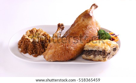 roasted duck with brown rice and nuts and minced meat stuffed gollash Royalty-Free Stock Photo #518365459
