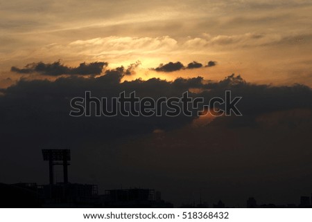 Sunset in the city, Amazing sunset over building on the town, Strom cloud sky over city , Cloudscape

