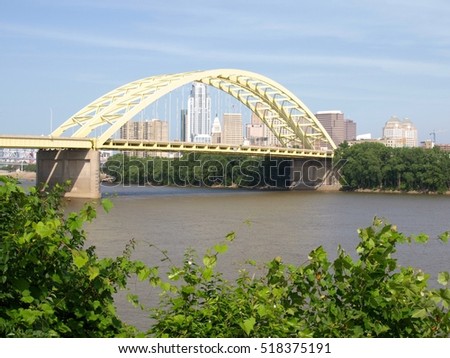 A yellow bridge over the Ohio River.