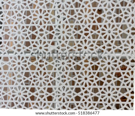 abstract background texture of zooming closeup view  whitish hexagonal grating shape of outdoor gardening table with stencil brownish well attracted decorative textile floor as background. wallpaper 