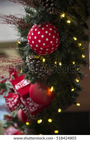 Christmas decoration with balls, flowers, baskets, tree and lights